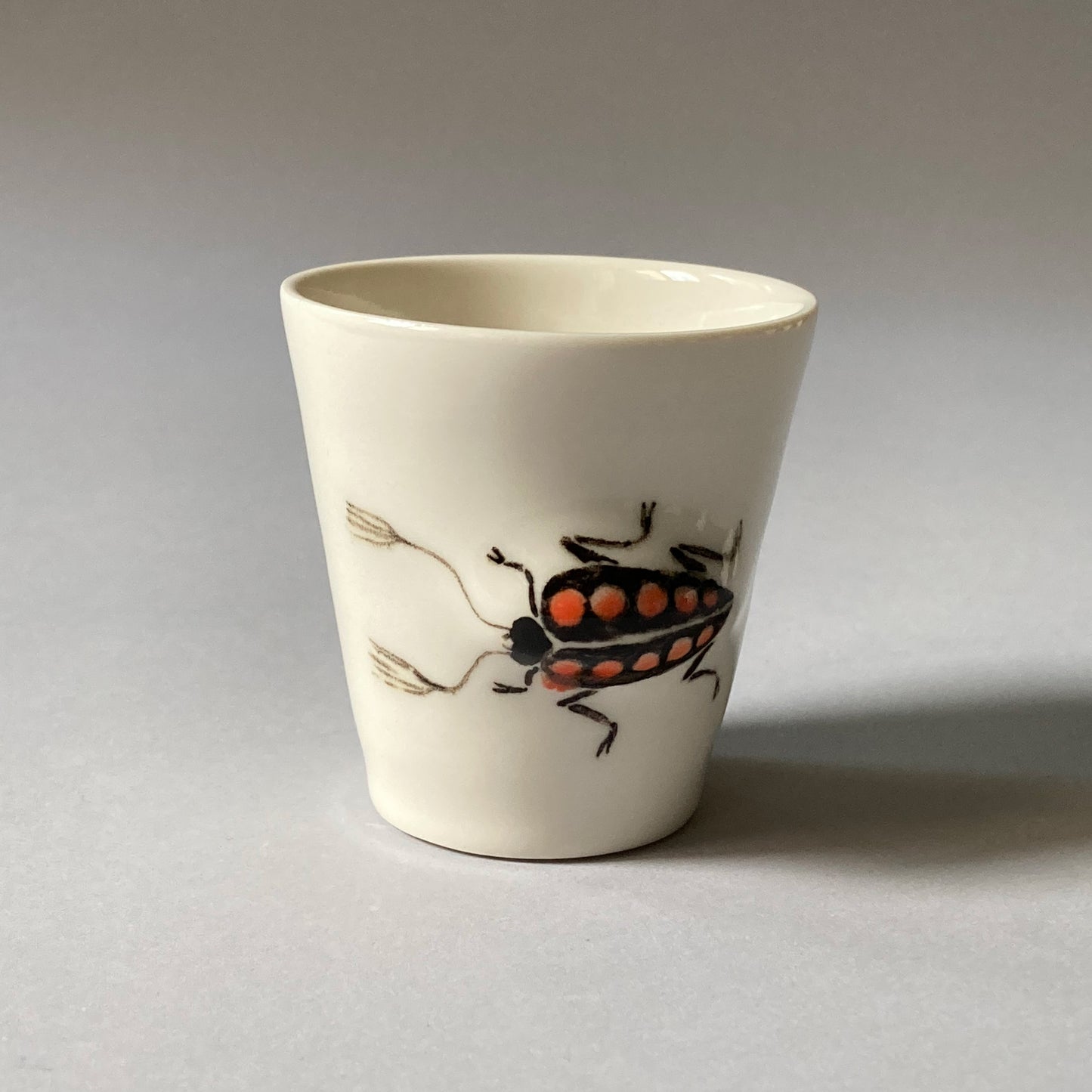 Espresso cup with beetle