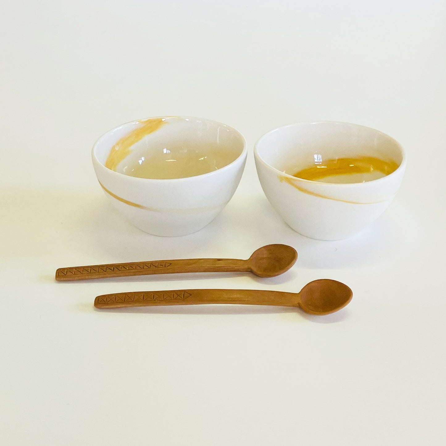 Set of 2 yellow bowls with spoons